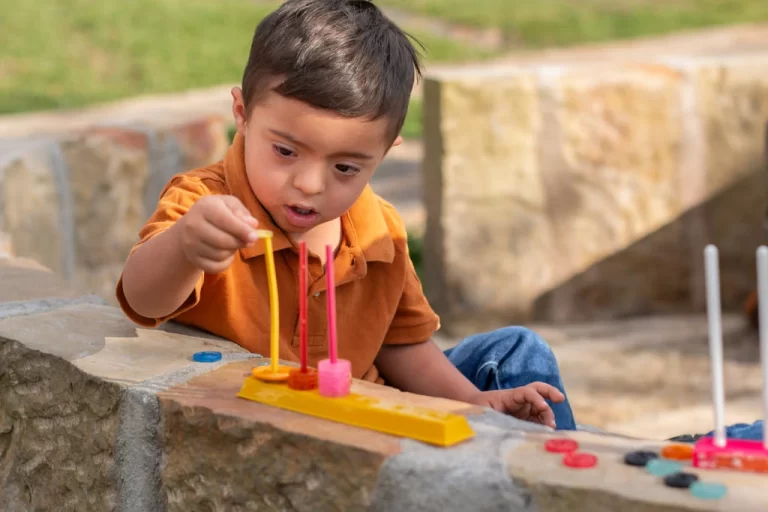 kid with an intellectual disability playing